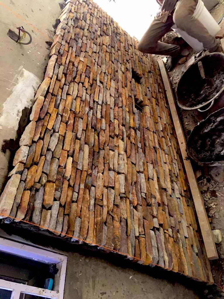 Craftsman laying natural stone